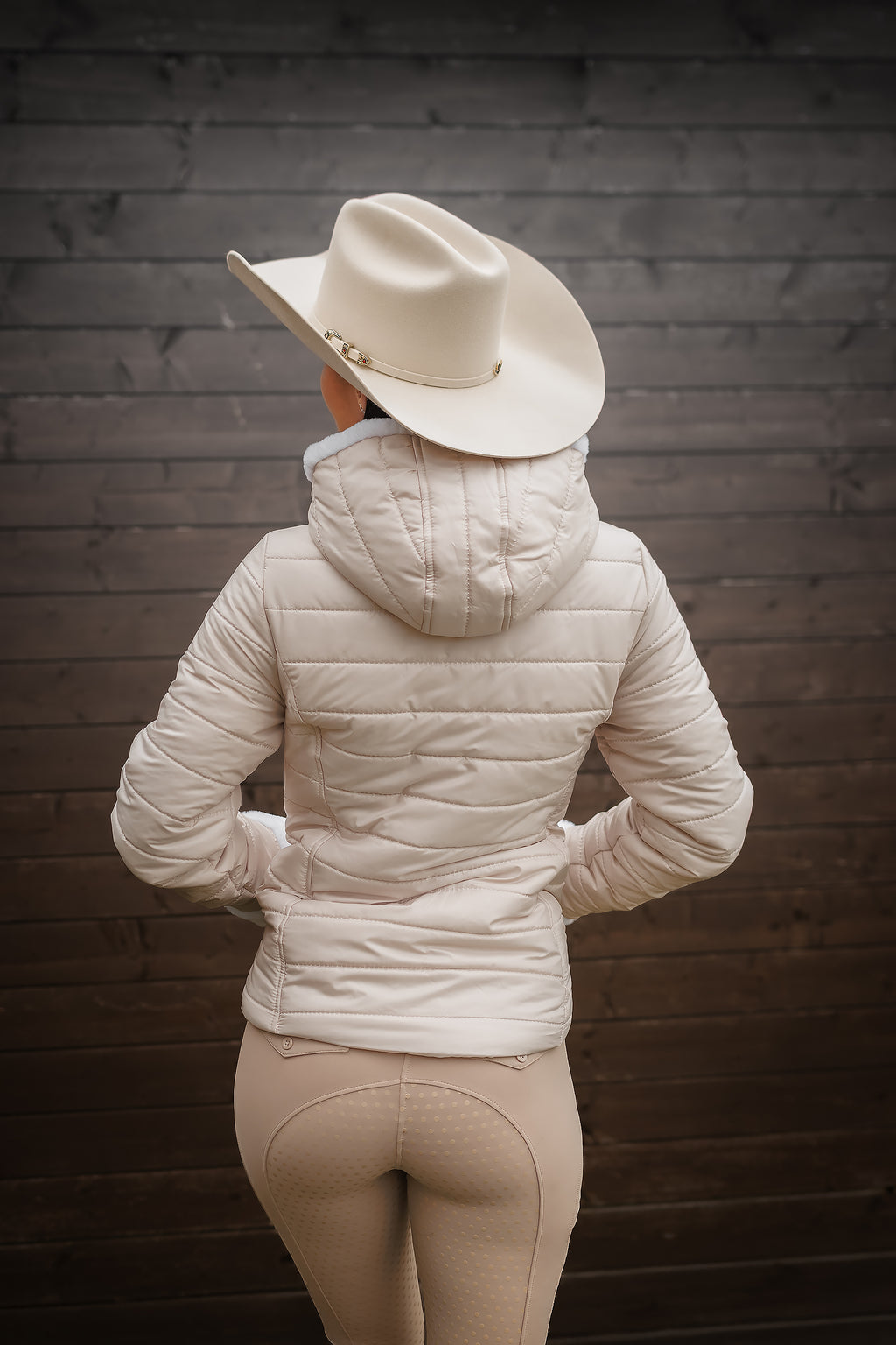 Back view of the Horse Spirit Riding Winter Jacket - Features the ergonomic cut and technical design of this premium beige winter riding jacket.