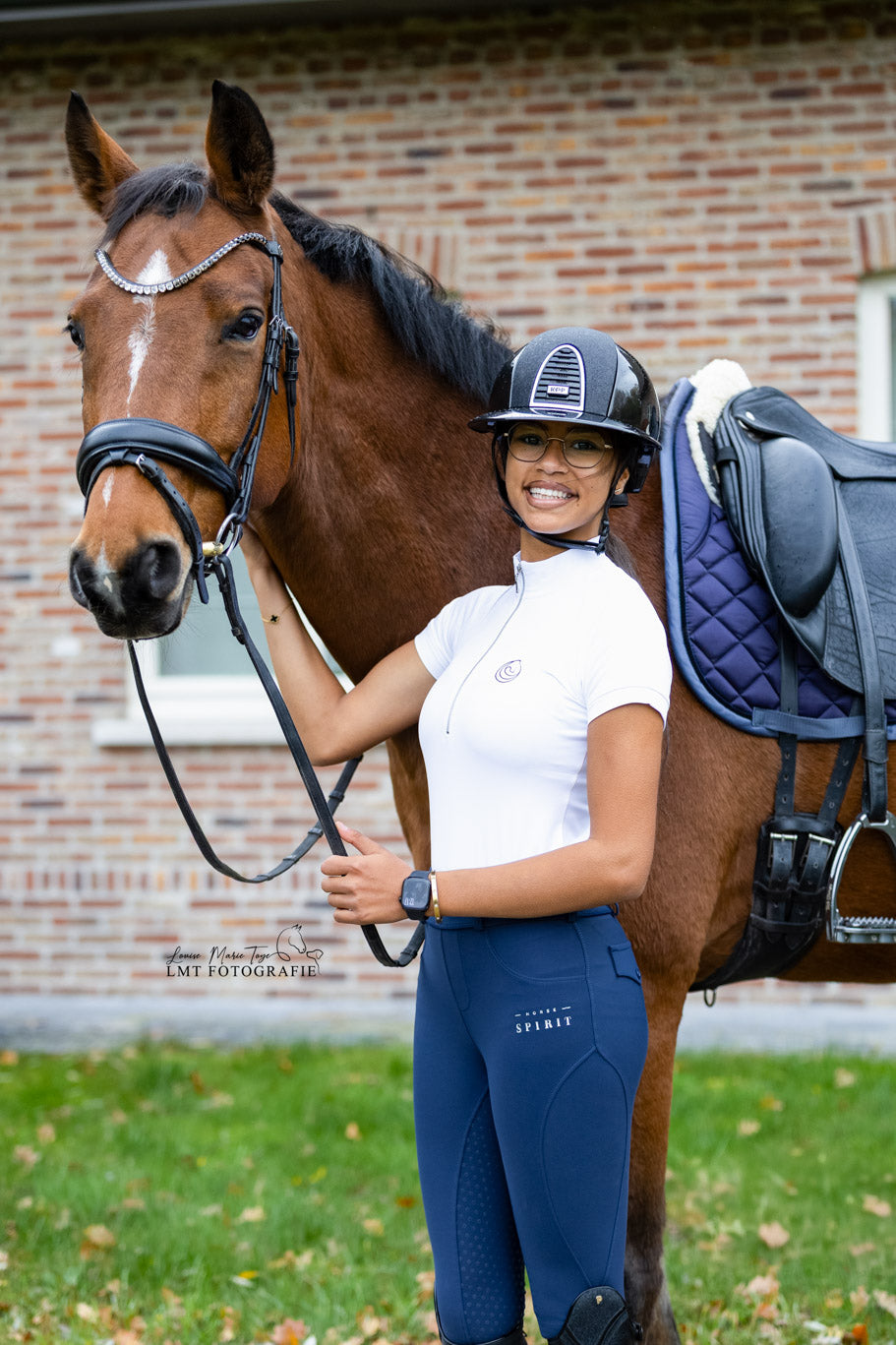 Horse Spirit Show Riding Tee in crisp white - Front view on model showing the athletic competition fit, iconic HORSE Spirit logo, and premium performance fabric.