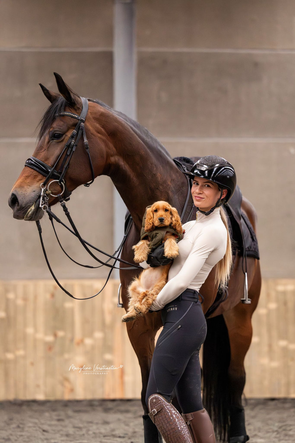 Horse Spirit Show Thermal Riding Layer in beige - Side view on model in action showing the tailored feminine fit, premium combed interior, and elegant competition design.