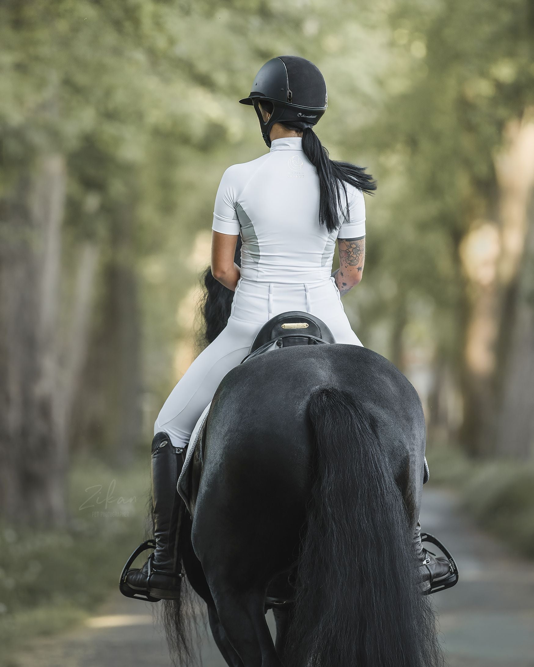 Back view of the Horse Spirit Show Riding T-Shirt - Shows the fitted athletic cut, strategic side mesh panels, and ultra-lightweight fabric in action.