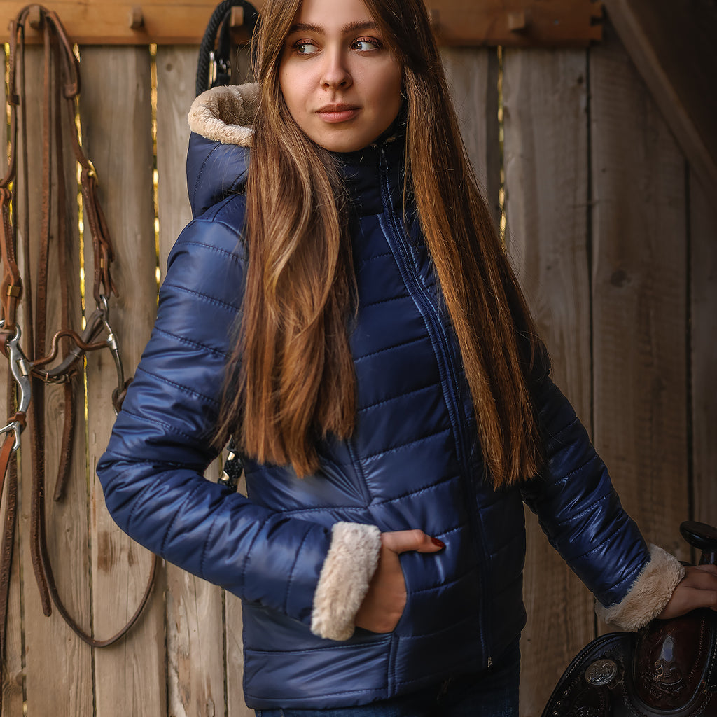 Horse Spirit Riding Winter Jacket in blue - Front view on model showing windproof construction, elegant fur trims, and ergonomic riding cut for cold-weather protection.