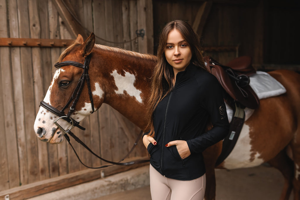 Horse Spirit Sweatshirt in action - Equestrian in black sweatshirt showcasing comfortable, versatile style during stable activities.