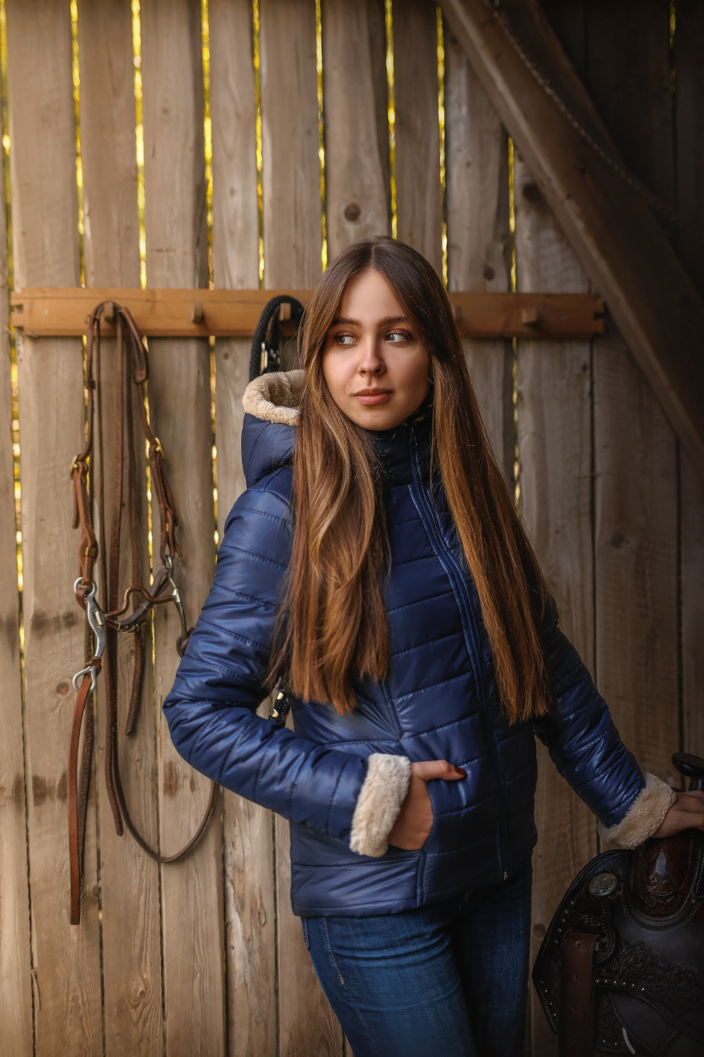 Horse Spirit Riding Winter Jacket in blue - Front view on model showing windproof construction, elegant fur trims, and ergonomic riding cut for cold-weather protection.