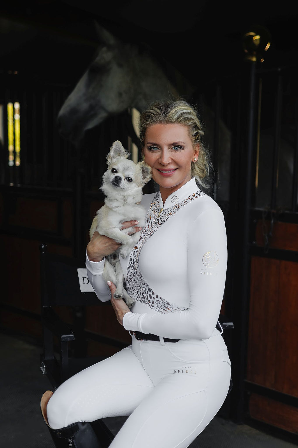 Horse Spirit Leopard Print Premium Bodysuit - Side view on model in stable showing sophisticated leopard print, sleek fit, and elegant cut for riding and casual wear.