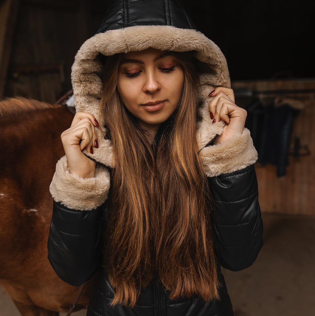 Horse Spirit Riding Winter Jacket in black - Front view on model showing windproof construction, plush fur trims, and ergonomic riding cut for cold-weather protection.