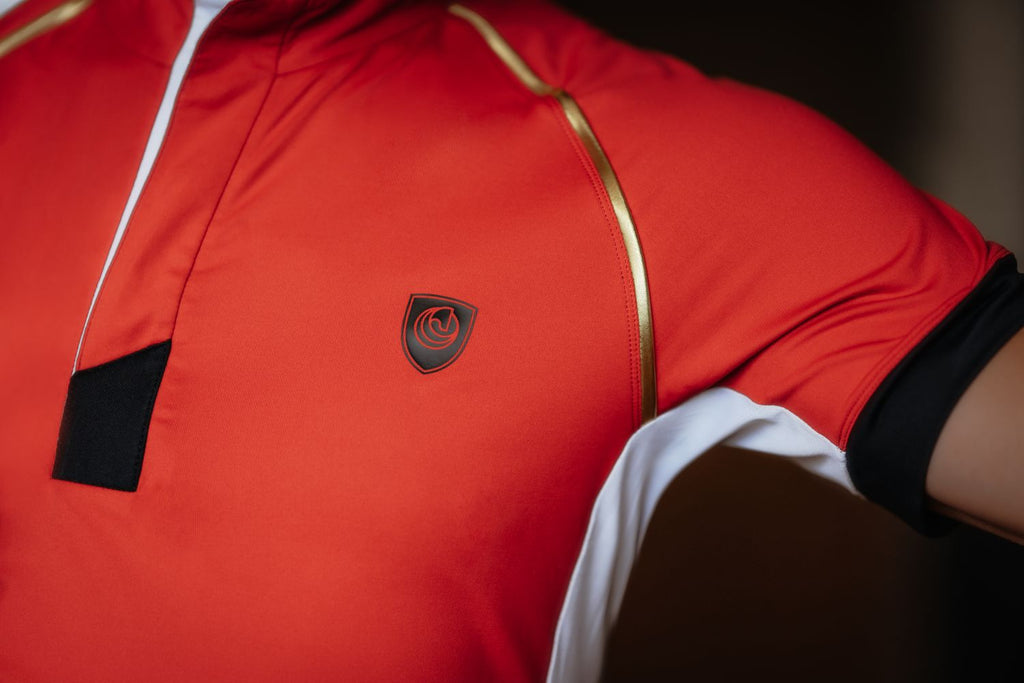 Close-up detail of the Horse Spirit Sport Polo - Side mesh panel on premium red technical fabric for enhanced ventilation.