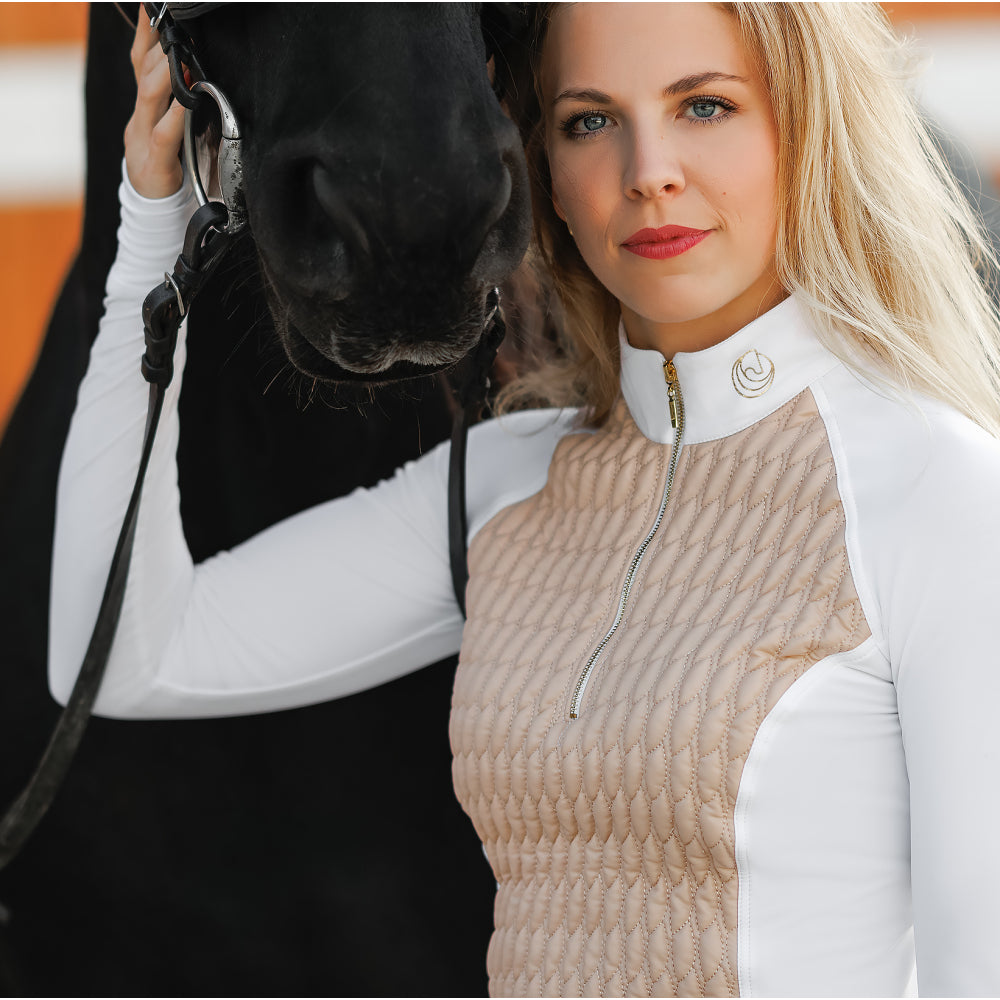 Close-up detail of the Horse Spirit Hybrid Jacket - Insulated panel and breathable side fabric on beige and white technical jacket.