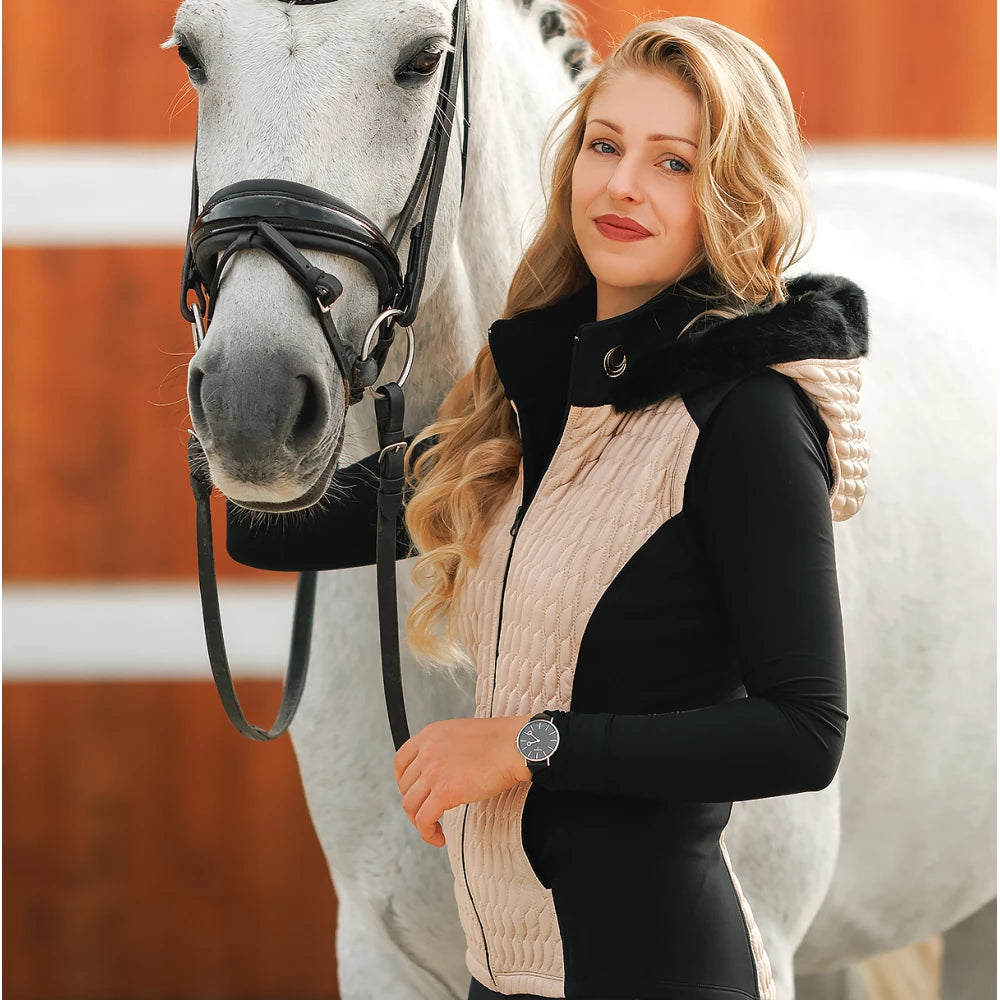 Beige and Black Horse Spirit Riding Vest with Hood shown on a rider, highlighting the quilted design and integrated hood.