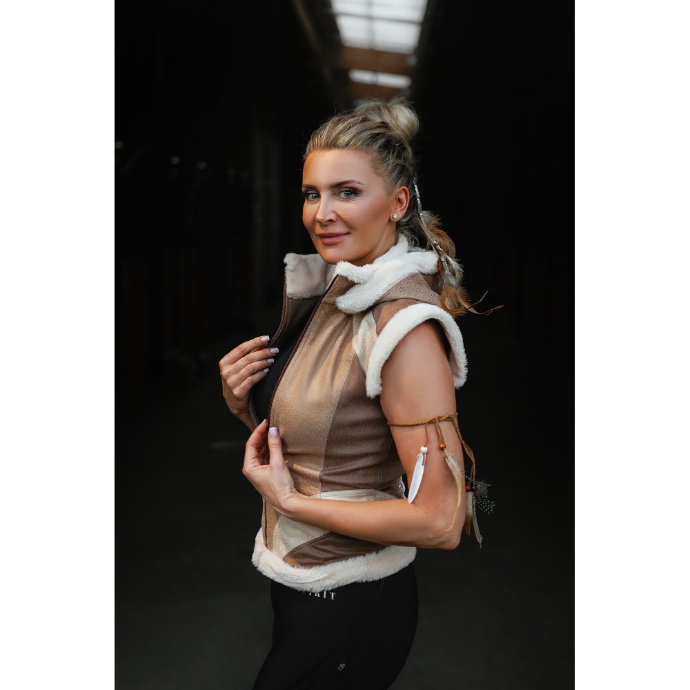 Side view of a woman wearing the fitted Horse Spirit Warrior vest in Beige, showing how the garment moves with the body and maintains a sleek, feminine curve from every angle.